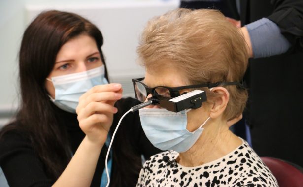 image is a photo of a lady wearing a face mask, during her procedure