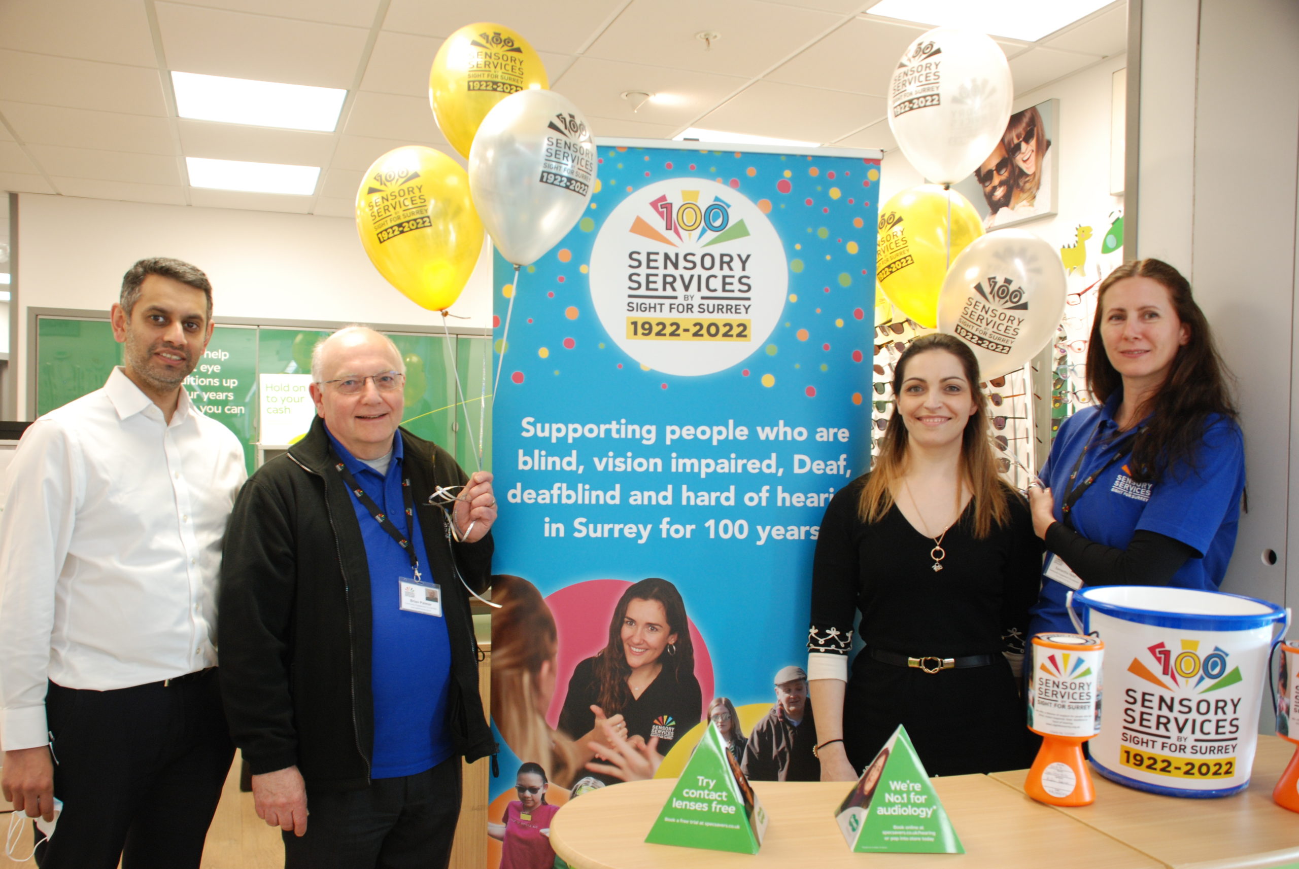 Amit and Mihaela from Specsavers Kiln Lane with Brian and Samantha from Sight for Surrey in Specsavers store fundraising.