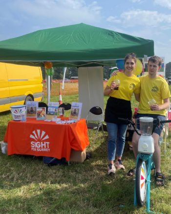 Volunteer, Callum, with Vivienne at the Shere Hill Climb, busy making smoothies.