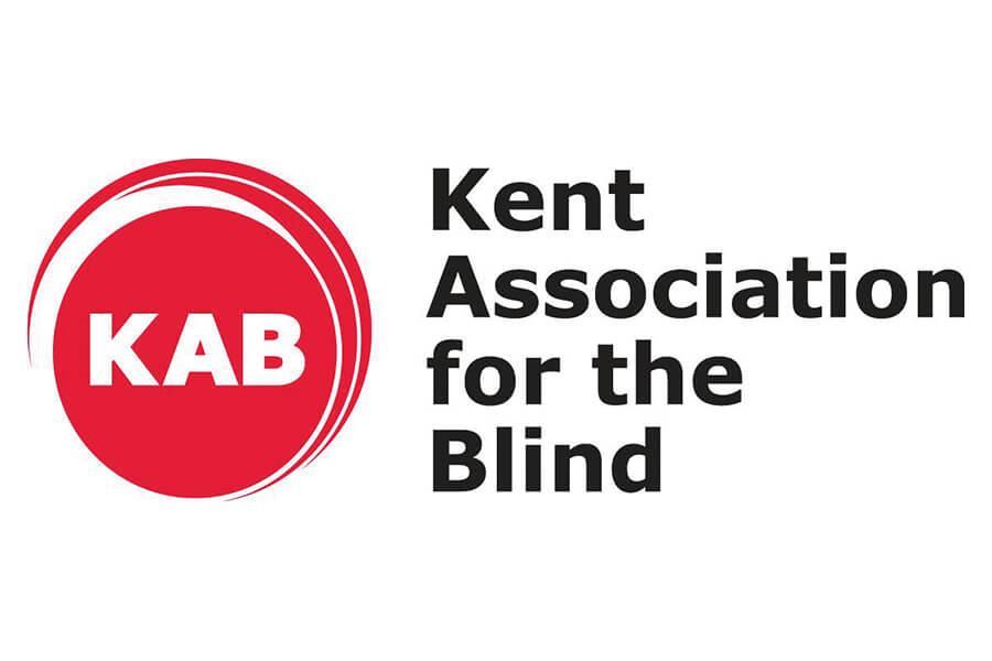 Kent Association for the Blind logo. The letters K A B inside a red circle.
