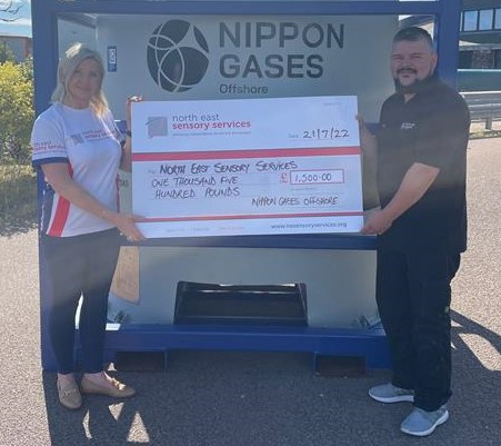 Lynn Batham and Scott Walker with cheque - Nippon donation story