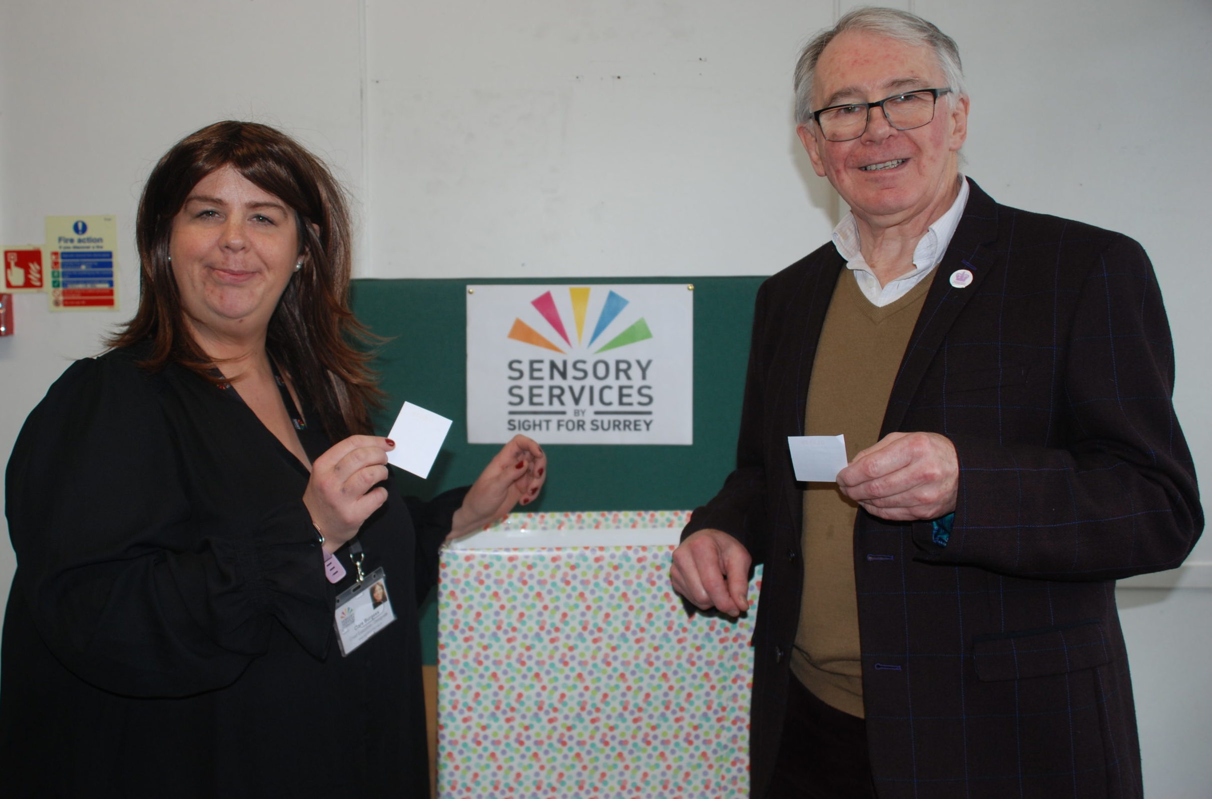 Clare Burgess and Bob Hughes drawing raffle tickets.