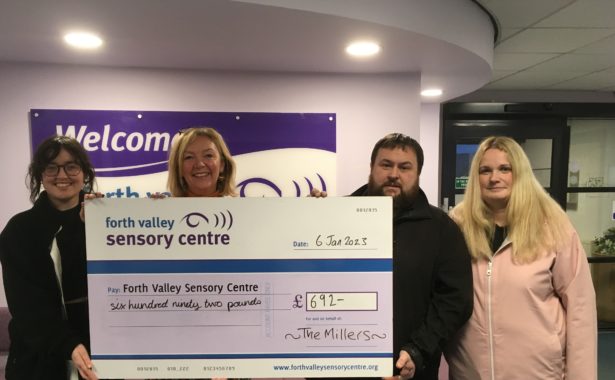 (L-R): Sara Burns, FVSC’s energy adviser, Jacquie Winning, chief executive of FVSC, Gordon Miller and Pamela Miller holding a large cheque to Forth Valley Sensory Centre for £692.
