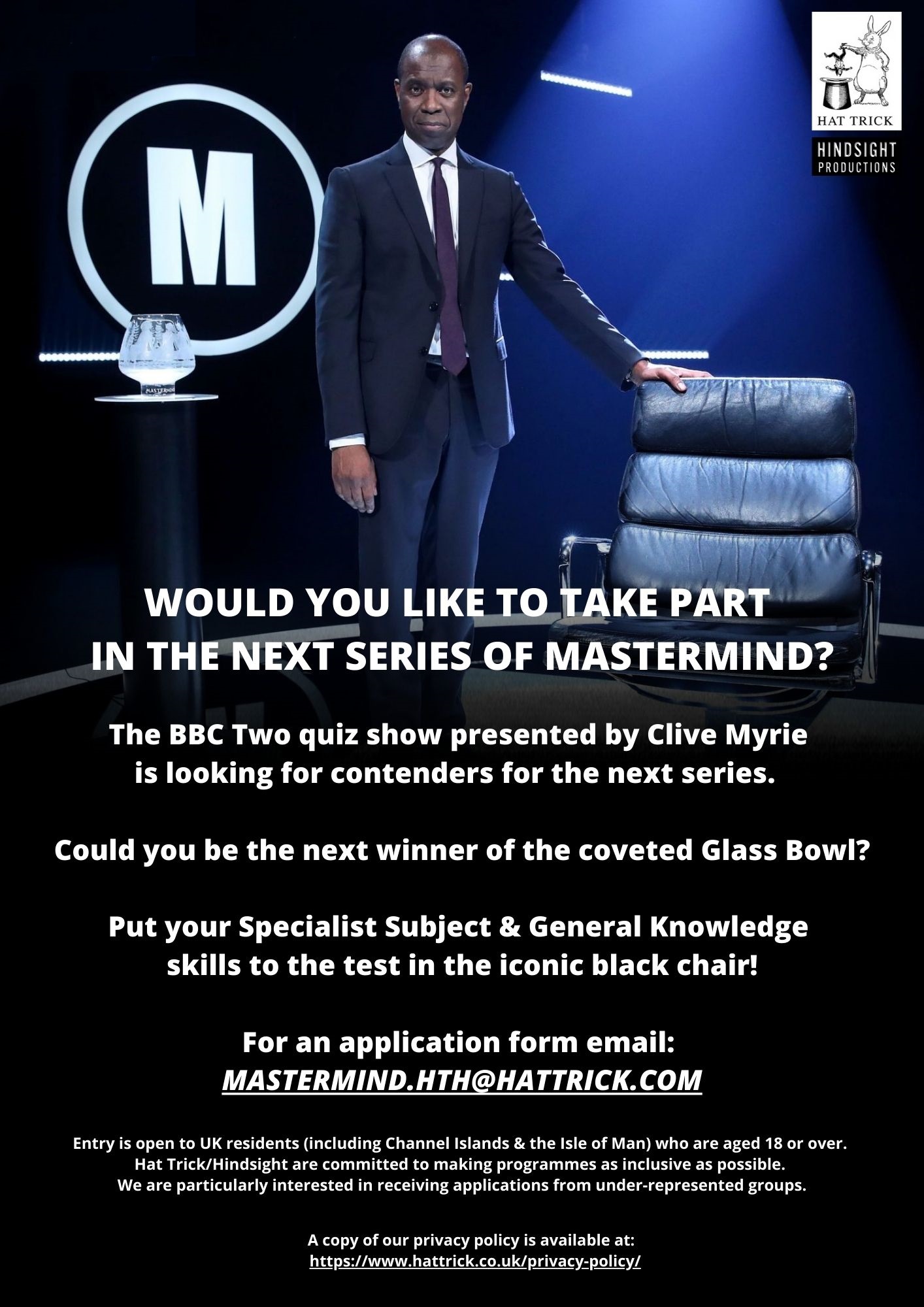 Mastermind Presenter Clive Myrie stands with his hand on the iconic Mastermind Black Chair on his right hand side, and the Mastermind Winner Trophy on his left. Terms and conditions are displayed underneath in white writing on a black background.