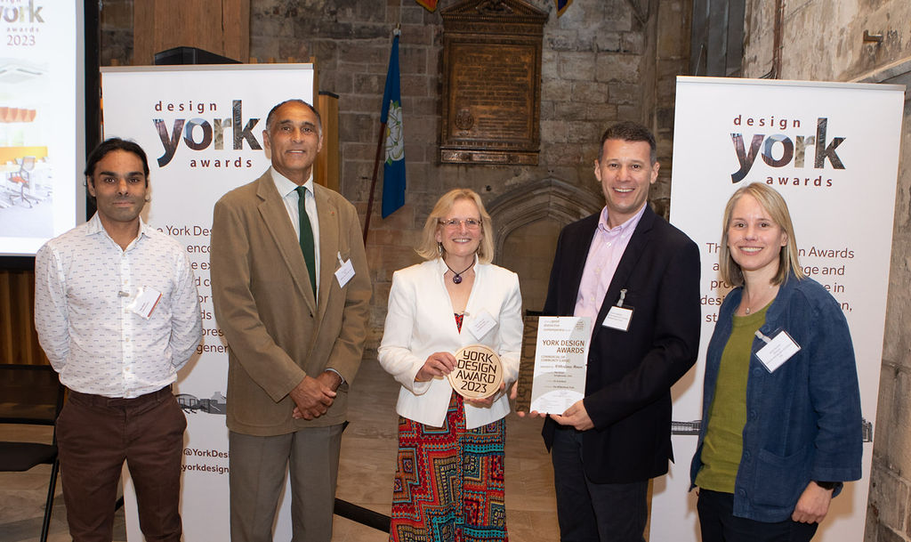 Winning team from William Birch & Sons Ltd, Wilberforce Trust and KS Architects holding York Design Awards 2023 trophy and certificate.