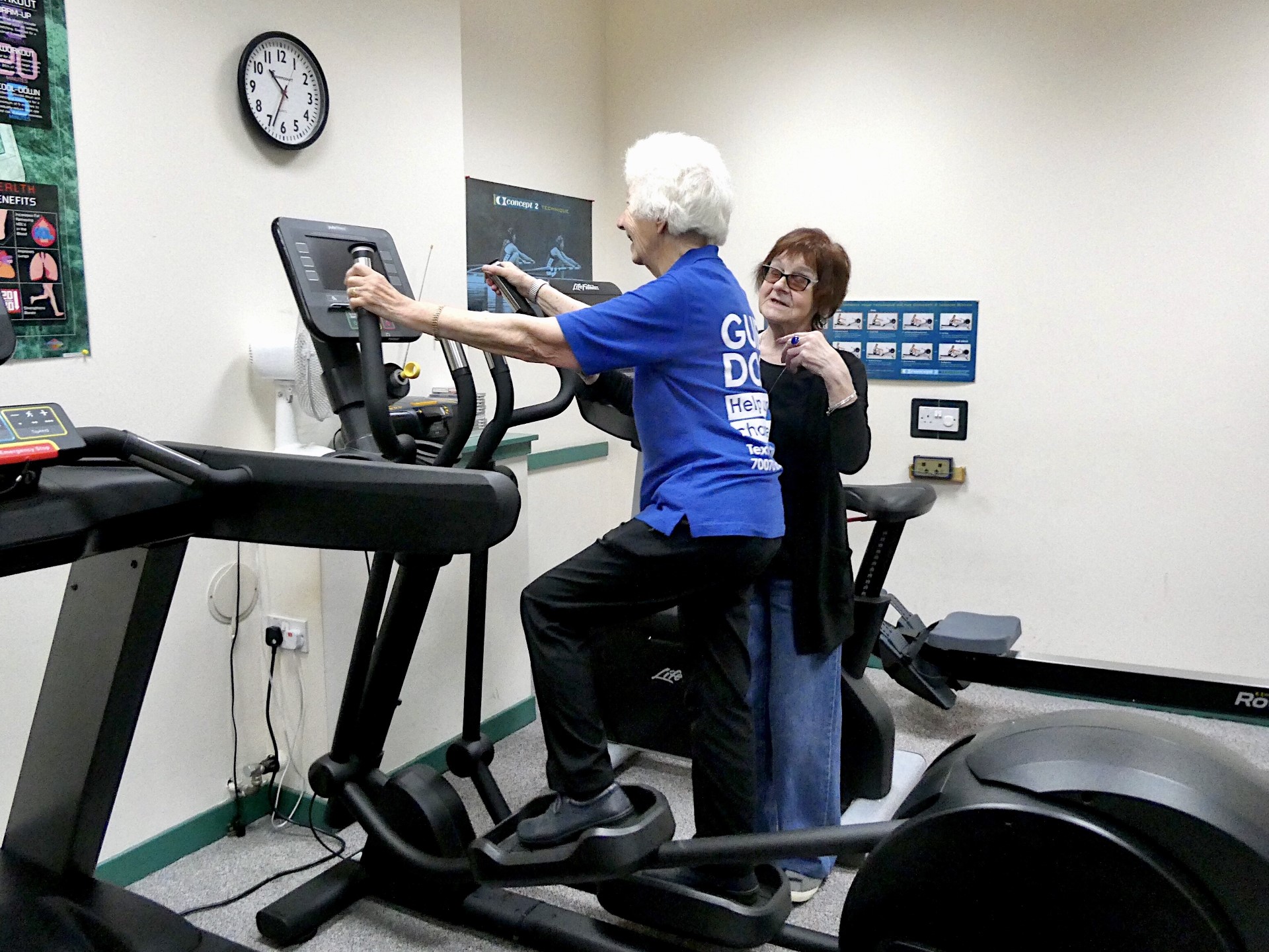 NESS service users and volunteers Mary (using cross trainer) and June