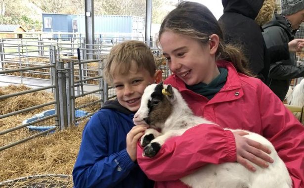 Ailsa and Fergus Milne, pictured with a goat.