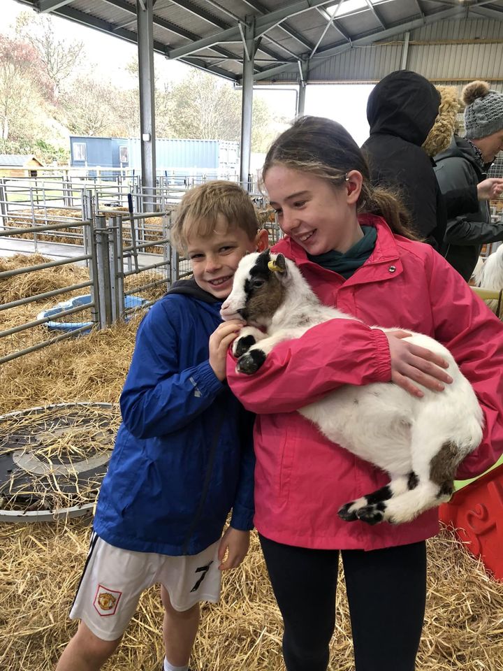 Ailsa and Fergus Milne, pictured with a goat.