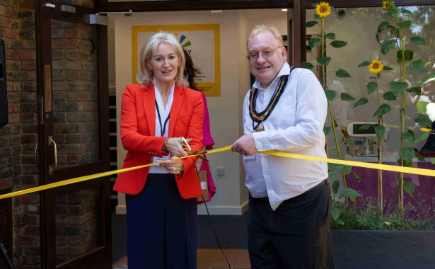 Picture credit: Calvin Cheung. Christine Wilmshurst and Tim Hall cutting ribbon.