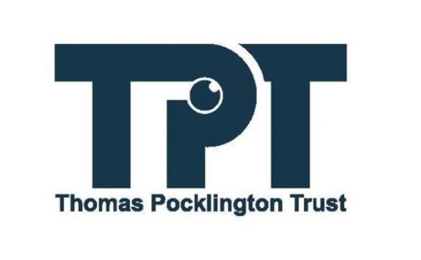 Thomas Pocklington Trust logo. Large TPT letters with the words Thomas Pocklington Trust underneath enclosed in a rectangle. Letters, words and the rectangle border are a dark blue. Within the P of TPT is a small round eye looking upwards.
