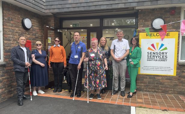 Volunteers and staff celebrate the launch of Surrey Sight Loss Council outside Sensory Services by Sight for Surrey in Redhill.