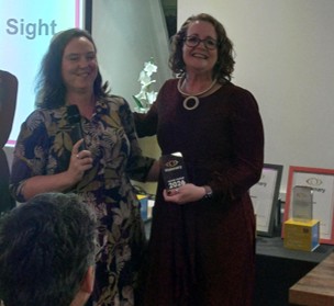 Eleanor Southwood from Fight for Sight is smiling, standing next to Hayley Grocock from Wakefield District Sight Aid.